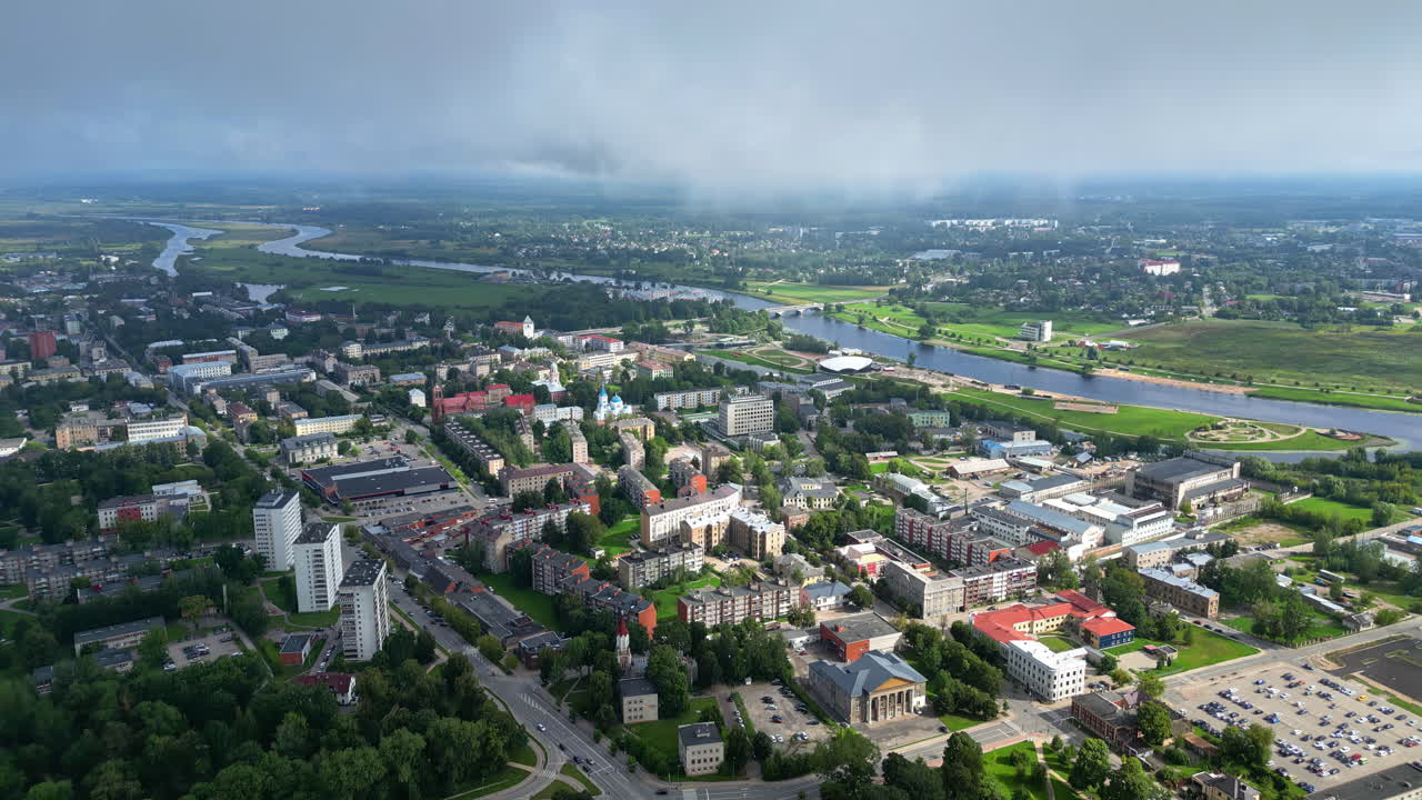 Aerial view of Jelgava cityscape with Lielupe river, residential areas, and Pasta sala