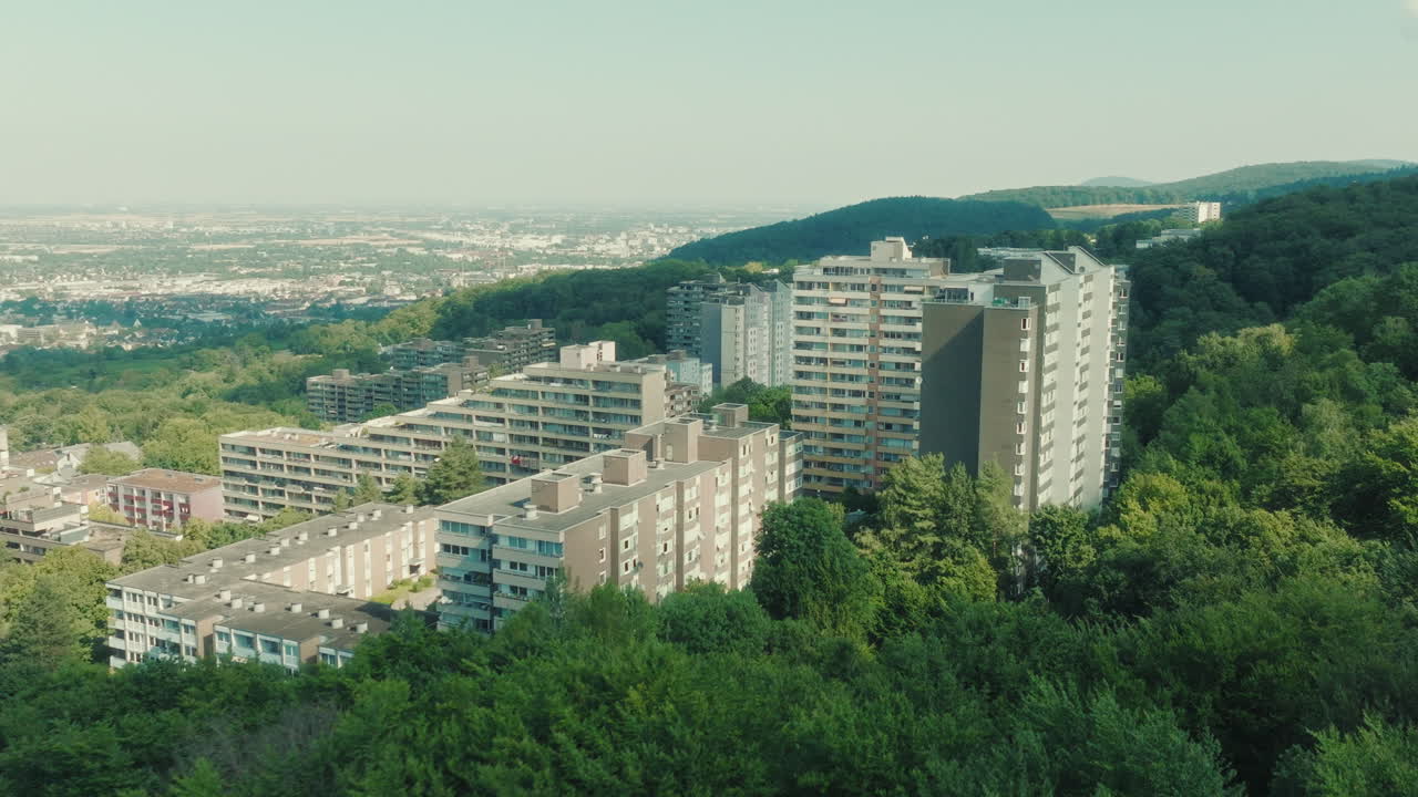 Aerial: Emmertsgrund white buildings and neighborhood during the day in Heidelberg, state of Baden-Wurttemberg, Germany, push in drone shot