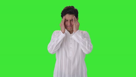 sick indian man suffering from headache green screen