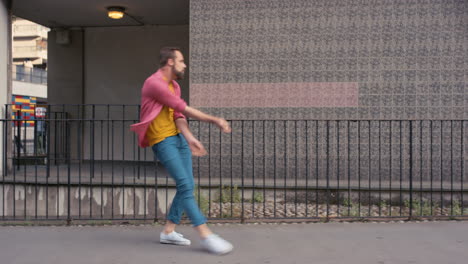 contemporary funky caucasian man street dancer dancing freestyle in the city