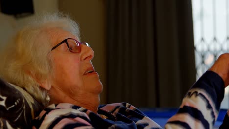 Senior-woman-using-digital-tablet-in-bedroom-4k