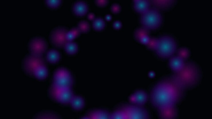 Abstract Purple and Blue Glowing Particles Floating on Black Background