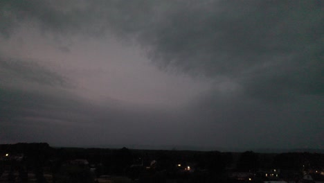dark cloudy sky over town at twilight