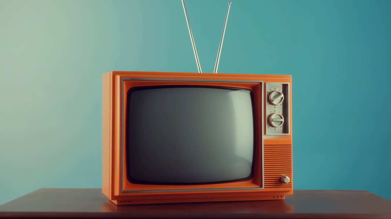 Retro Orange Television Set on a Wooden Table