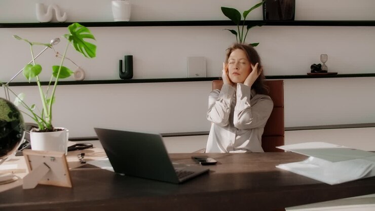 Woman in Office, Stressed or Relaxing