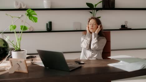 woman in office, stressed or relaxing