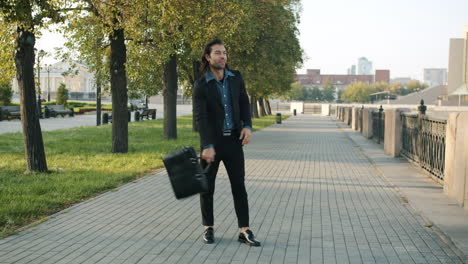 businessman walking in park