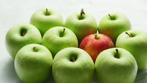 Green apples with red in heap