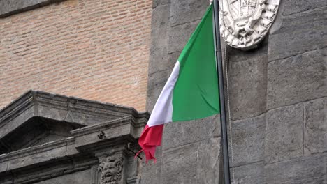 4k. italian flag waving in wind, located in piazza del plebiscito, naples