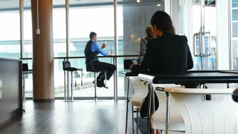 Female-executive-sitting-at-table