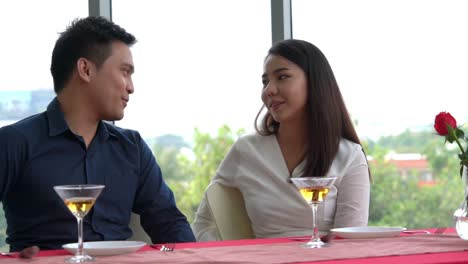 happy romantic couple eating lunch at restaurant