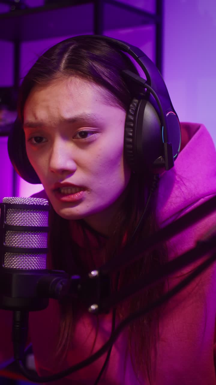 Woman with headphones and microphone streaming online