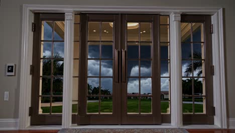 tornado visible through large glass doors