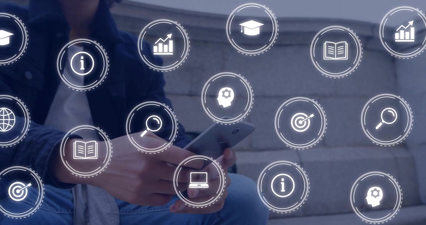 Seated male tapping smartphone on steps and causing education icons to fill foreground for study