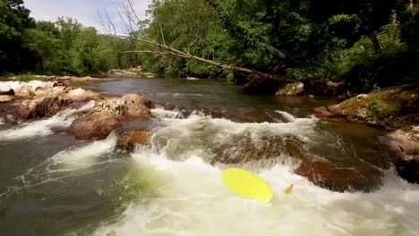 Drone-of-kids-playing-in-the-river-with-kayak-and-float