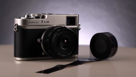 vintage-style camera with a roll of film