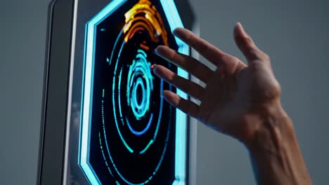 hand interacting with a futuristic interactive touchscreen display