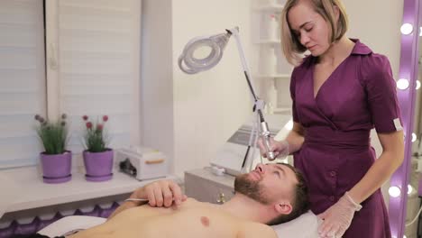 man undergoing facial treatment