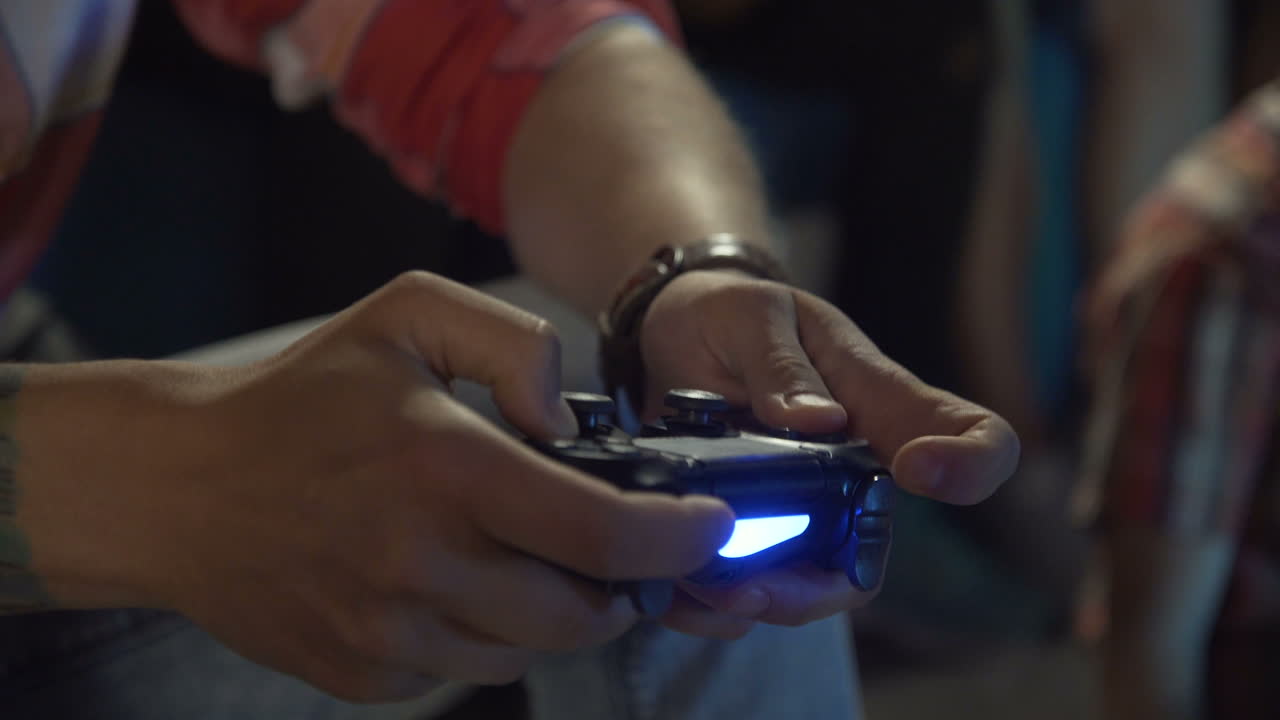 Person playing a video game with a controller