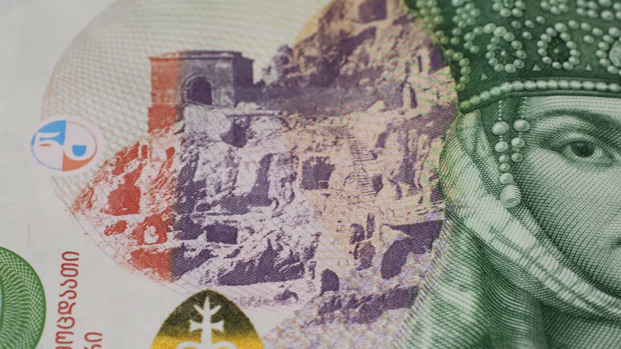 Five Georgian lari banknotes close-up. Universal currency converter GEL Central Bank. 5 lari paper money macro. Economy, financial and banking concept .