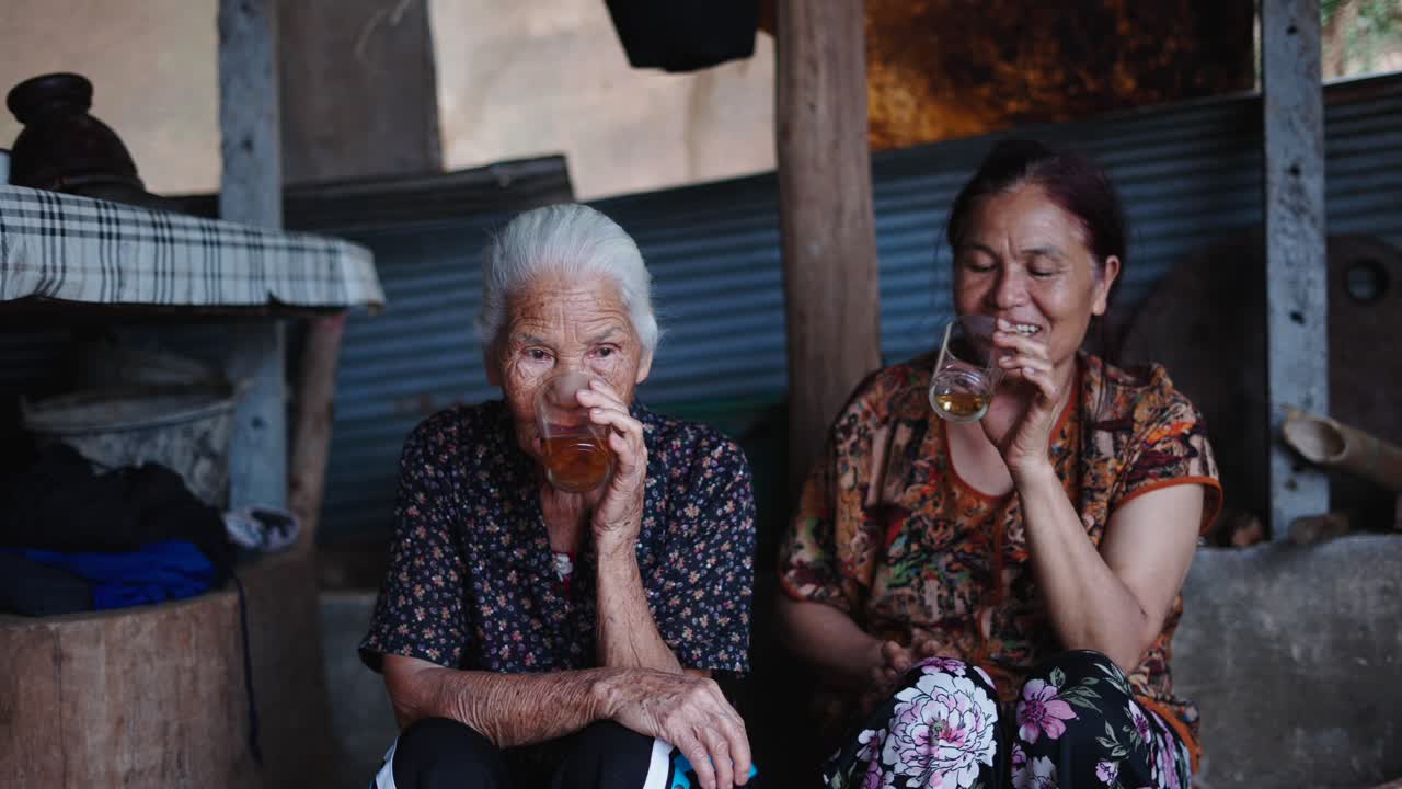 Two Elderly Women Enjoying Tea Together