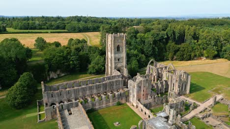 Drone-aerial-footage-of-the-historical-13th-century-Fountains-Abby-ruins---North-Yorkshire---England