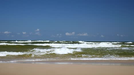 wave on a sandy beach. baltic sea, poland