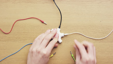 top view hands connecting data cables global sharing network concept desk from above - red epic dragon