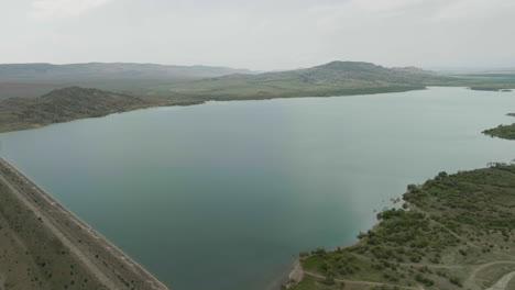 Dammed-Dalis-Mta-reservoir-with-dyke-in-steppe-landscape-of-Georgia