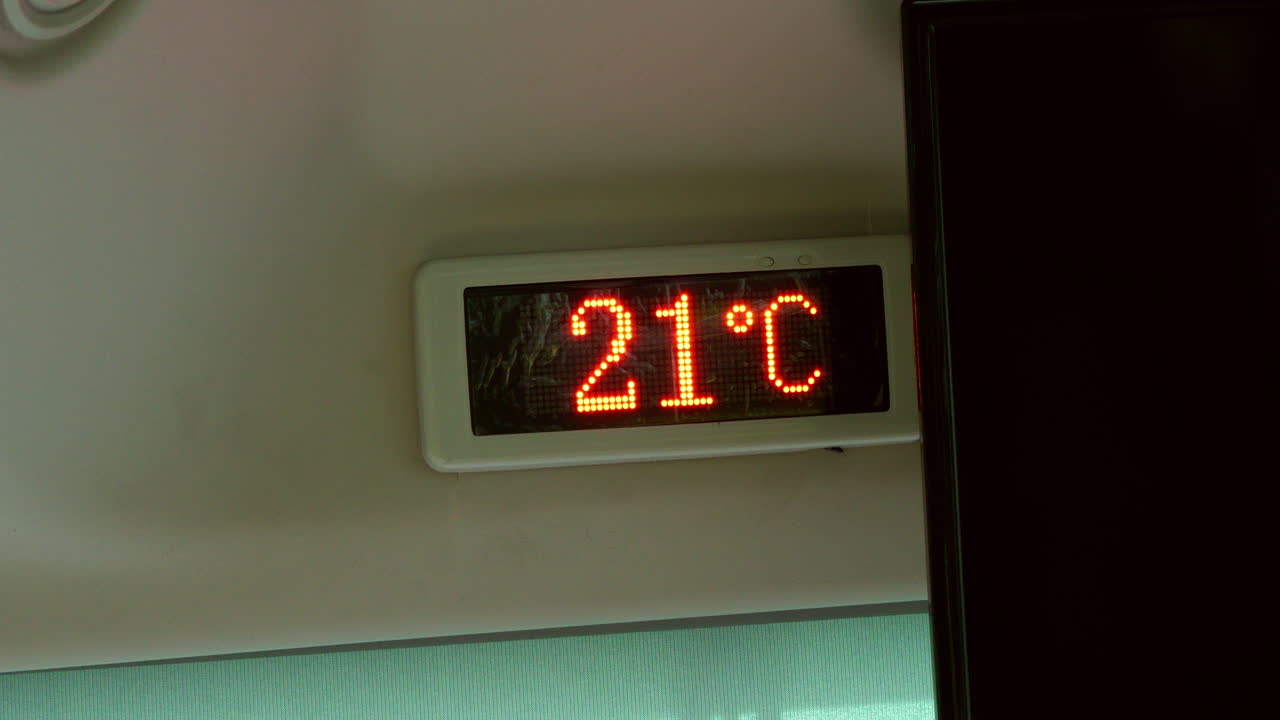 The electric bus display screen provides key travel data, showing speed and temperature on the go. Great for transportation and technology themes.