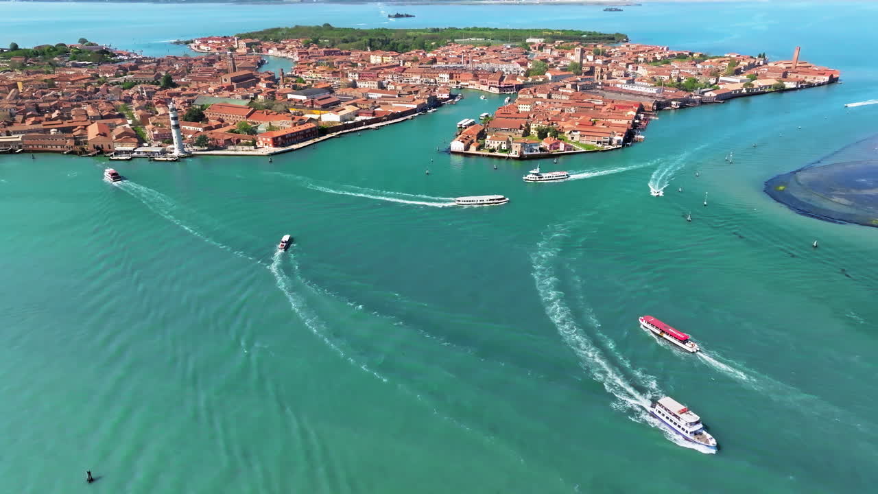 Aerial drone view of boats moving near Murano Island, Venice, Italy