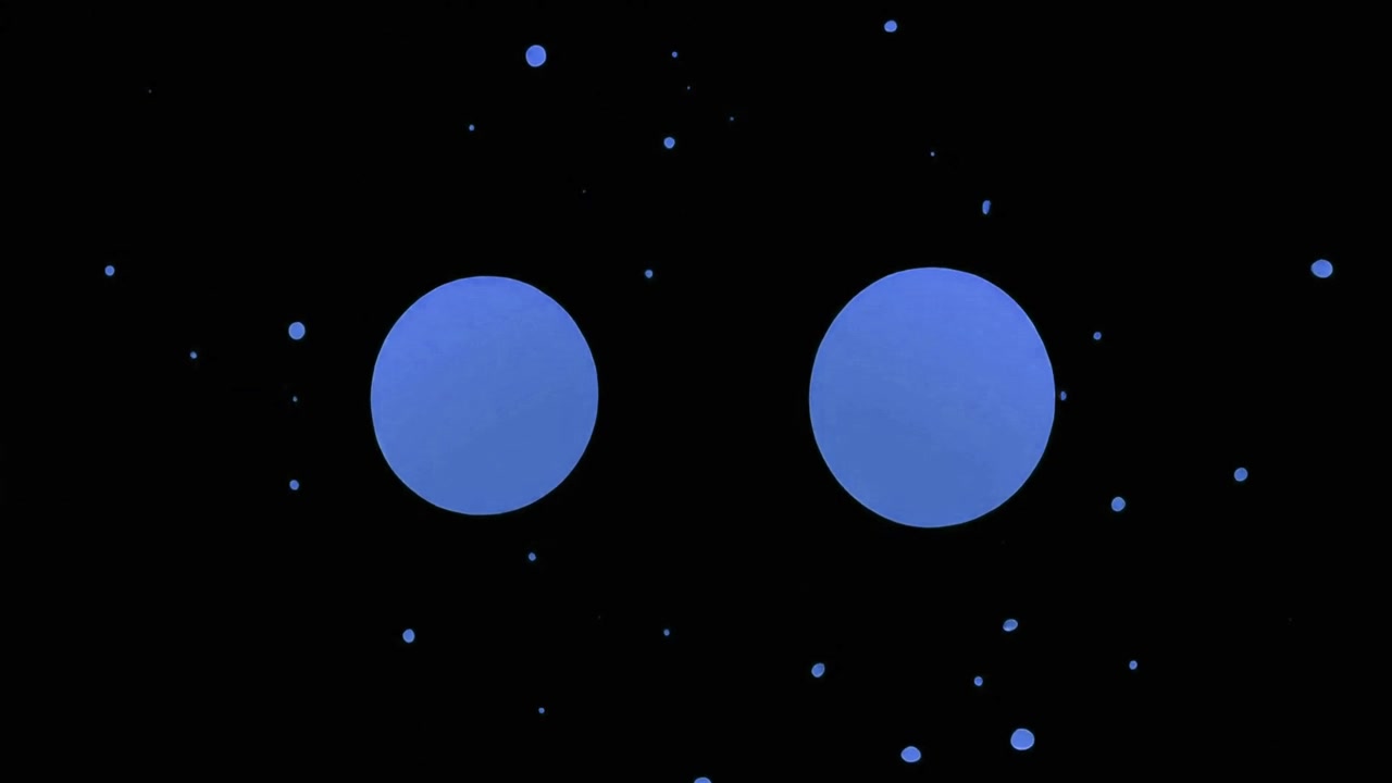 Liquido blu che schizza e forma due cerchi perfetti su sfondo nero