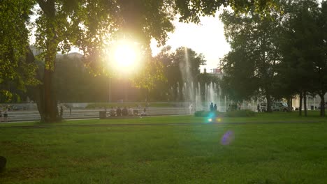 park scene with fountains and people