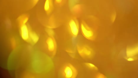 movimientos rápidos del fondo parpadeante. textura borrosa de resplandor dorado. textura sin costuras con pañuelos de oro amarillo