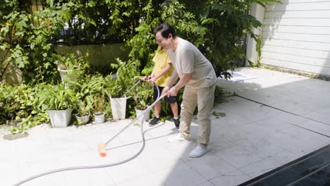 Asian-man-and-boy-in-the-backyard