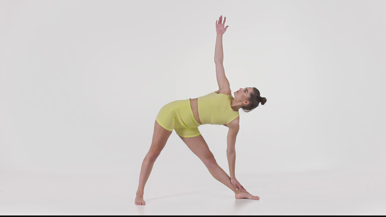 Woman Performing a Yoga Triangle Pose