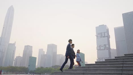 asian business people ascending steps