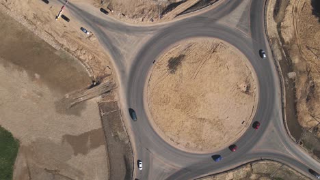 4k top down aerial view of a traffic roundabout. road construction