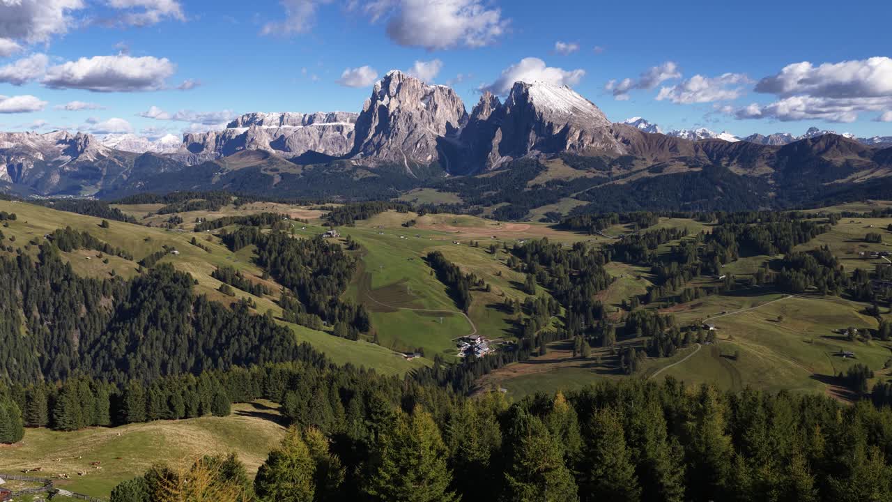 Seiser Alm, Alpe di Siusi largest alpine pasture Alm in Europe near Bolzano in South Tyrol, in northern Italy. Aerial video. Alpine meadows and mountain range views