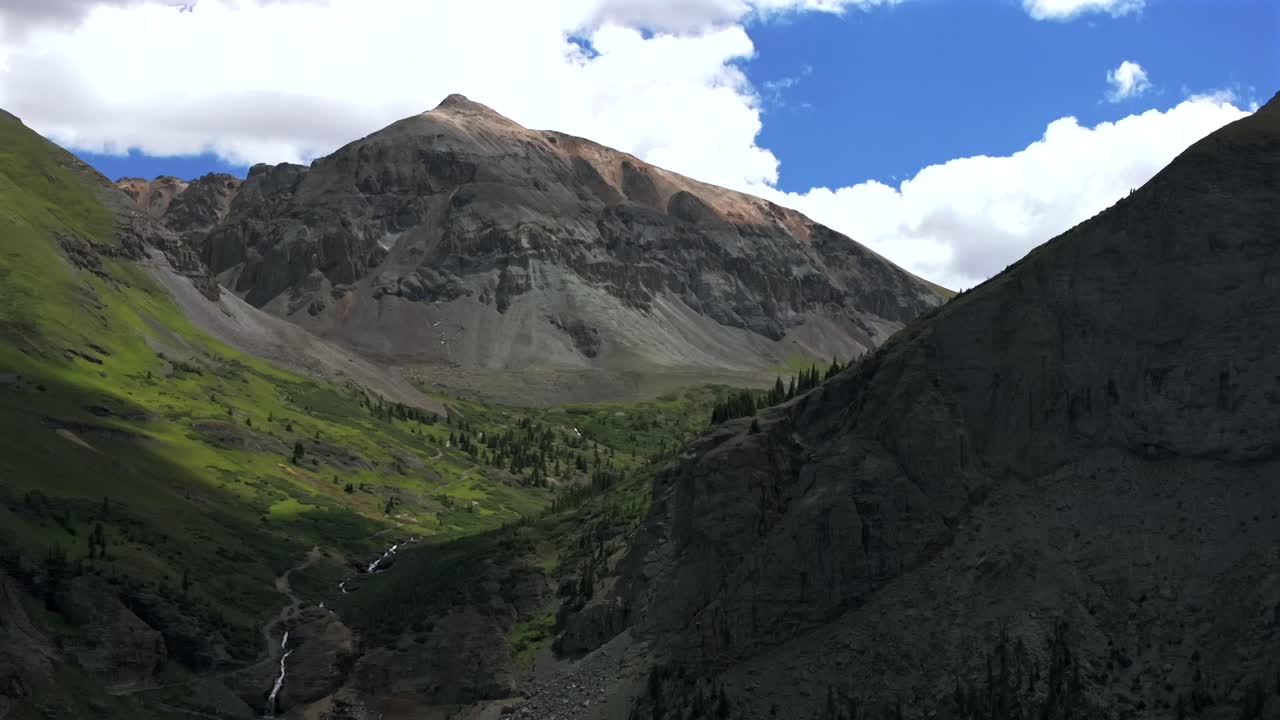 Yankee Boy Basin 4wd hiking bluesky cliffside valley aerial drone forward pan up motion Ouray Ridgway stunning summer Telluride Colorado Box Canyon Black Bear Pass Road Bridal Veil Falls Aspen Forest