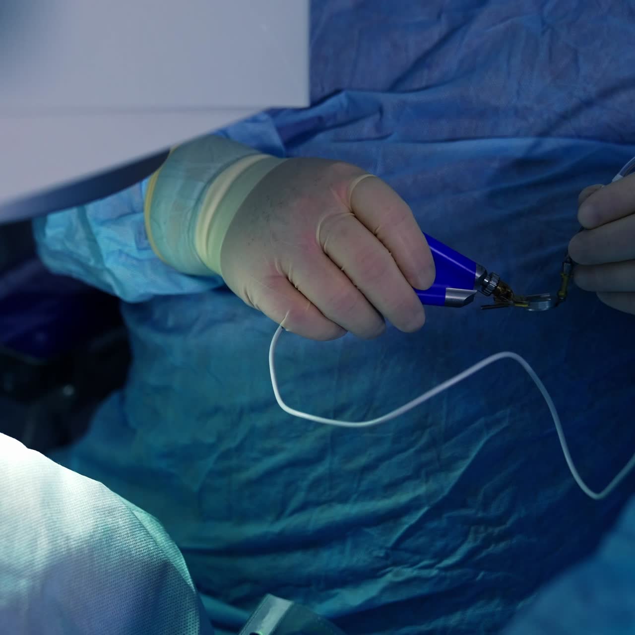 Doctor during eye surgery process. Surgeon in the operating room during ophthalmic surgery