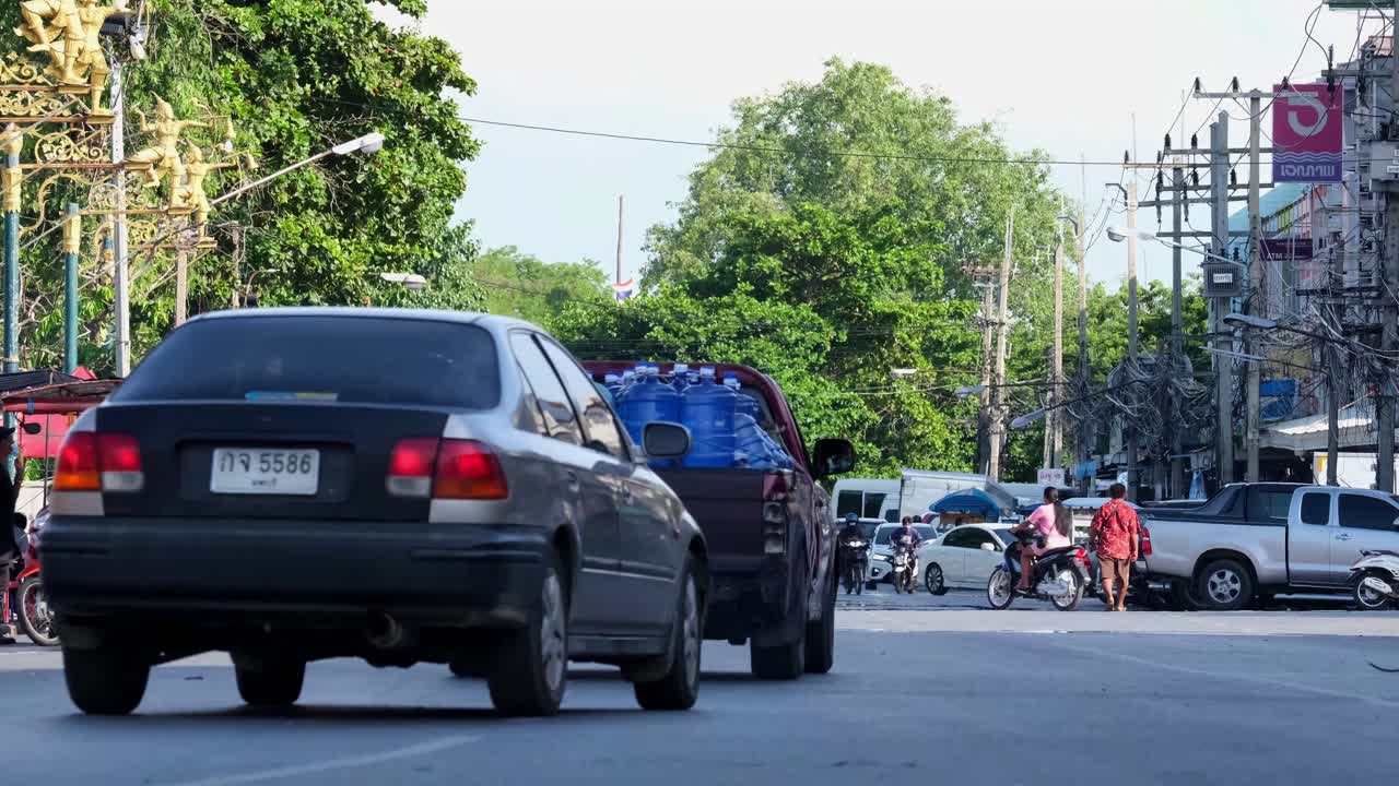 Long Tailed Macaque, Macaca Fascicularis has caused problem to the safety of local traffic and local businesses by recklessly crossing the street in a tourist hotspot in Lop Buri Thailand.