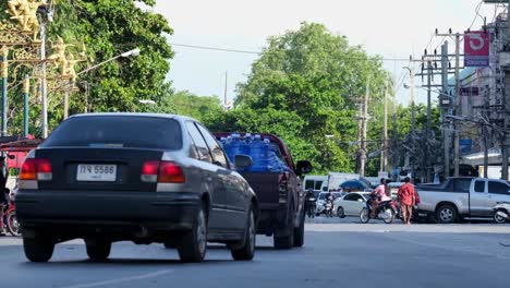 long tailed macaque, macaca fascicularis has caused problem to the safety of local traffic and local businesses by recklessly crossing the street in a tourist hotspot in lop buri thailand.