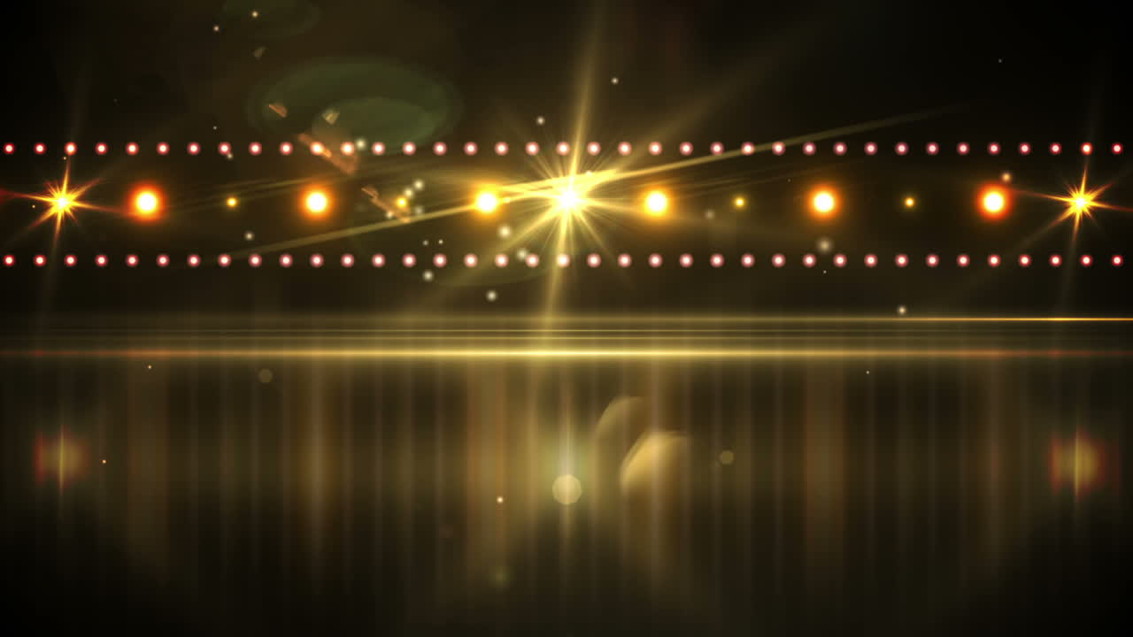 Yellow lights shining on black background