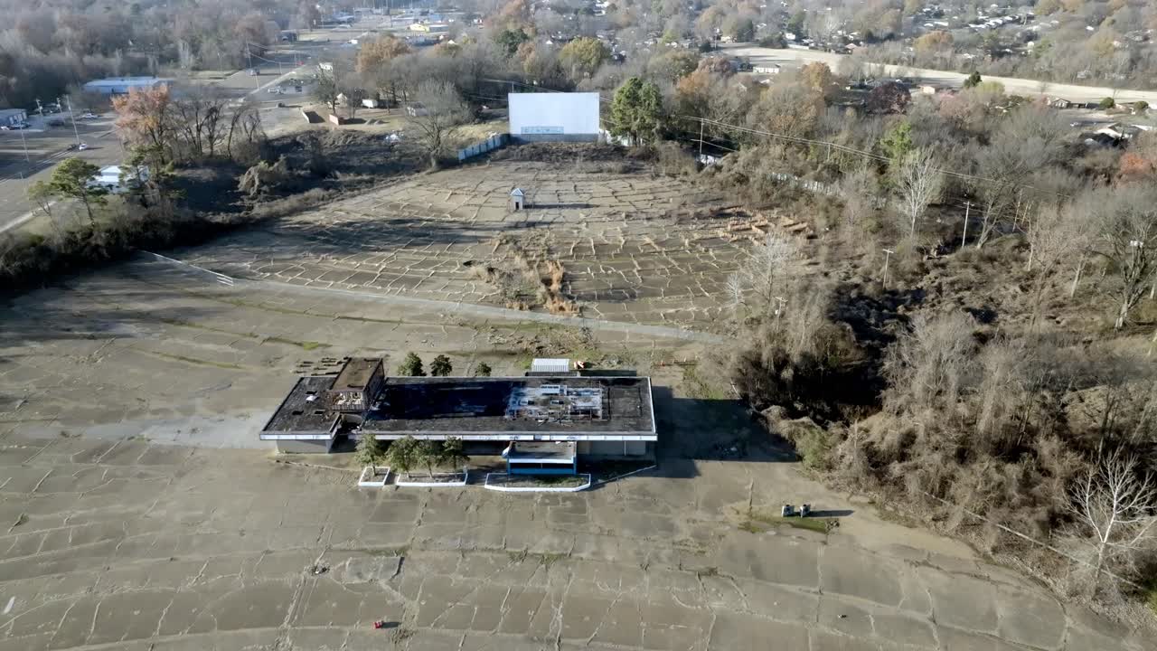 Abandoned Twin Drive In movie theater in Memphis, Tennessee with drone video moving in from high view