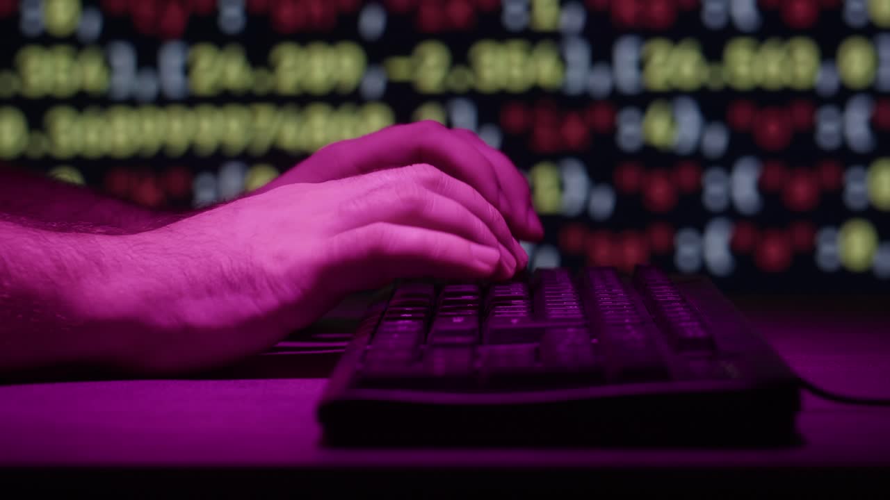 Person Typing on a Keyboard at Night