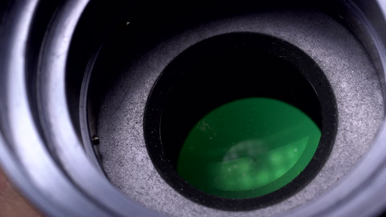 Aperture or iris mechanism in rotation. Camera lens aperture close up. Concept of photo, video job.