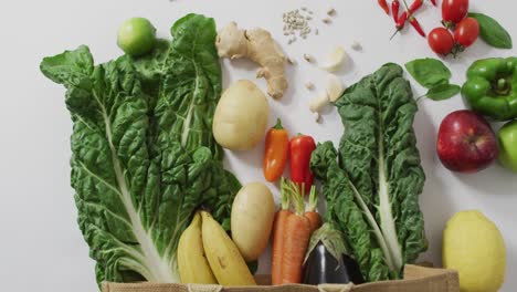 Video-of-fresh-fruit-and-vegetables-on-white-background