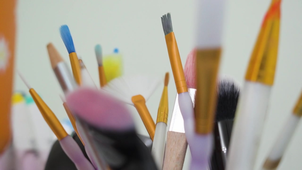 Extreme close up look at the bristles of art and makeup brushes.