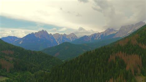 as dusk settles, the town is bathed in golden light, enhancing the beauty of the dolomite backdrop.